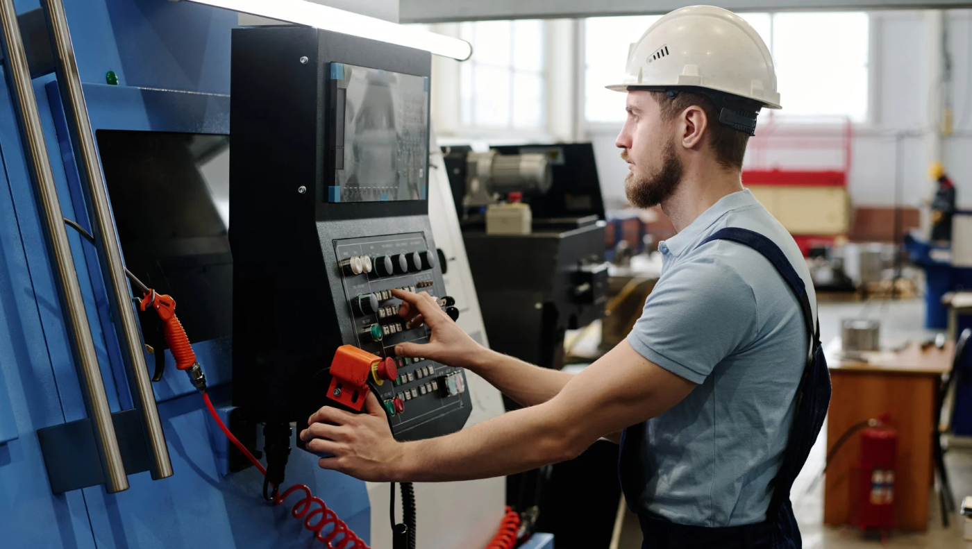 Production manager checking a manufacturing monitoring system