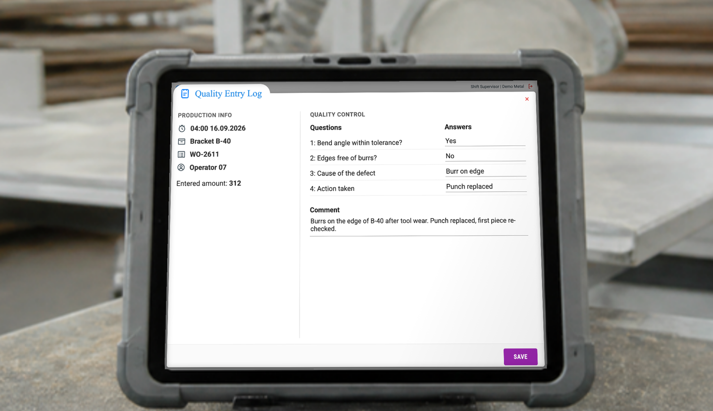 Rugged tablet on a factory bench showing the GlobalReader Quality Entry Log for Bracket B-40, work order WO-2611: four checklist questions answered, bend angle within tolerance, edges not free of burrs, cause and action recorded, and a Save button